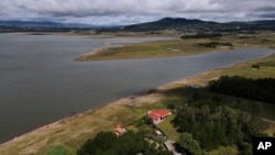 The banks of the Villa Victoria reservoir are exposed due to low water levels in the state of Mexico, Oct. 10, 2023. 