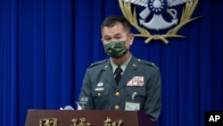 In this photo released by the Taiwan Ministry of National Defense, Major general Huang Wen-chi, the assistant deputy chief of general staff for intelligence speaks during a press conference in Taipei, Taiwan, Feb. 14, 2023. 
