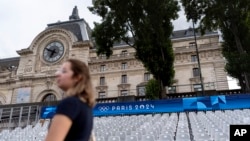 Spectator seats line the Seine river in front of the Musee d'Orsay, ahead of the 2024 Summer Olympics, in Paris, France, July 17, 2024.