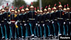 Soldiers of Brazilian Armed Forces take part in a parade during Army Day celebrations in Brasilia.