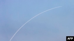 FILE - A missile from Israel's Iron Dome air defence system launches to intercept rockets fired from south Lebanon near Kiryat Shmona in northern Israel on June 14, 2024. 