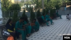 FILE - A group of medical students from India resting on a bench at the campus of Osh State University's medical facility, photo taken on May 24, 2024, Osh, Kyrgyzstan.