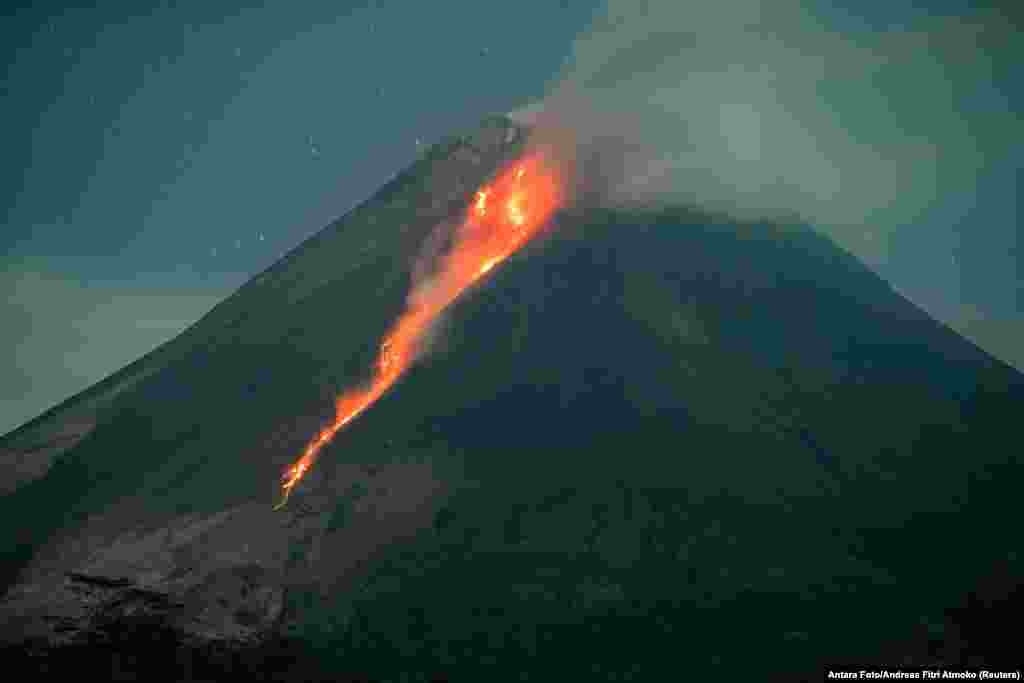 The Merapi volcano sends out hot lava as seen from Turi, Sleman, Yogyakarta, Indonesia.