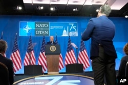 A reporter stands to ask a question at the conclusion of a news conference with U.S. President Joe Biden following the NATO Summit in Washington, July 11, 2024.