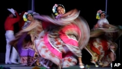 FILE - In this May 5, 2015, photo, dancers from Jalisco, Mexico, perform during Cinco de Mayo celebrations in Portland, Ore.