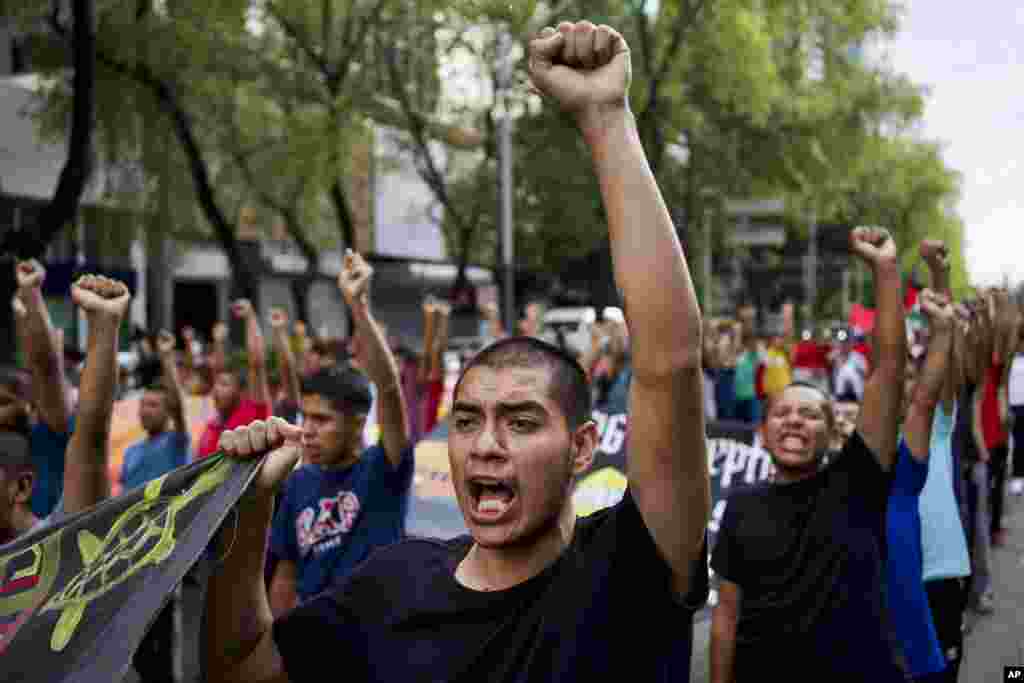 Classmates of the 43 Ayotzinapa students who went missing almost 10 years ago march to demand justice for their loved ones in Mexico City, Aug. 26, 2024. 