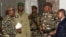 General Abdourahamane Tchiani, second from right, named the new head of state of Niger by leaders of a coup, arrives to meet with ministers in Niamey, Niger, July 28, 2023. 