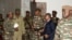 General Abdourahamane Tchiani, center, who was declared the new head of state of Niger by leaders of a coup, arrives to meet with ministers in Niamey, Niger, July 28, 2023. 