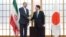 Japanese Foreign Minister Yoshimasa Hayashi, right, and Iranian counterpart Hossein Amir-Abdollahian shake hands before their meeting, Aug. 7, 2023, in Tokyo. 