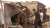 People check the rubble of their destroyed home after strikes at Allamat district in Khartoum, Sudan, June 1, 2023.