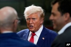 Republican presidential nominee Donald Trump talks before a business roundtable at a campaign event at Precision Components Group, Aug. 19, 2024, in York, Pa.