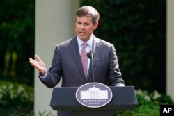FILE - David Ricks, chairman and CEO of Eli Lilly and Company, speaks at an event in the Rose Garden White House, in Washington, May 26, 2020.