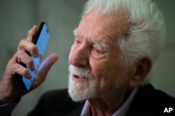 Marty Cooper, the inventor of first commercial mobile phone, during an interview with The Associated Press during the Mobile World Congress 2023 in Barcelona, Spain, Monday, Feb. 27, 2023. The four-day show kicks off Monday in a vast Barcelona conference center. It's the world's biggest and most influential meeting for the mobile tech industry. (AP Photo/Joan Mateu Parra)