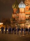 FILE - Police and the Rosguardia (National Guard) servicemen walk in Red Square, closed for celebrations on New Year's Eve, with the St. Basil's Cathedral, in Moscow, Dec. 31, 2022. 