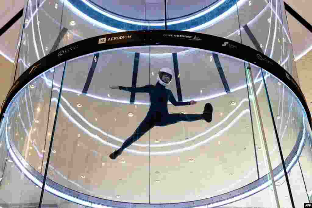 An athlete performs during the freestyle competition of the fifth FAI World Cup of Indoor Skydiving in Macau on April 19, 2024. 