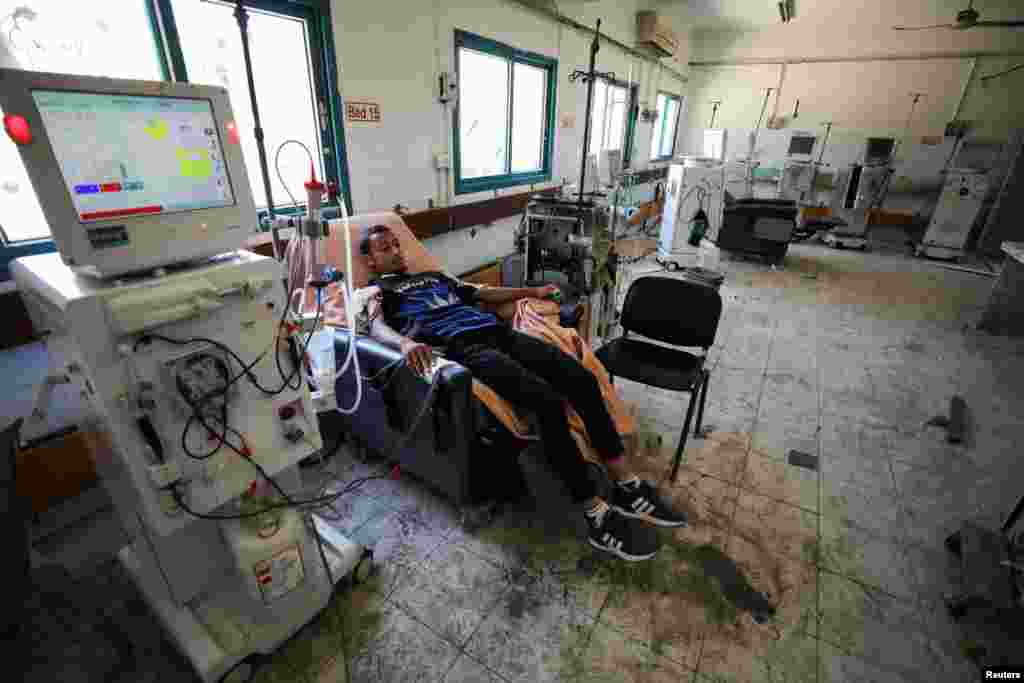 A Palestinian kidney patient undergoes dialysis, amid the Israel-Hamas conflict, at the remains of Al Shifa Hospital which was destroyed in the Israeli offensive, in Gaza City, June 5, 2024. 