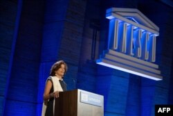 FILE - UNESCO Director-General Audrey Azoulay delivers a speech to announce the United States' request to return to the institution, at the UNESCO headquarters in Paris, June 12, 2023.