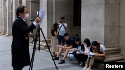 Journalists read the judgment over overseas same-sex marriages outside the Court of Final Appeal, in Hong Kong, China, Sept. 5, 2023. 