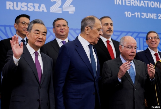 FILE - China's Foreign Minister Wang Yi, Russia's Foreign Minister Sergei Lavrov (C) and Brazil's Foreign Minister Mauro Vieira pose for a group photo during a meeting of the BRICS Plus Ministerial Council in Nizhny Novgorod, Russia, June 11, 2024.