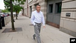 Metropolitan Police Department Lieutenant Shane Lamond departs federal court after pleading not guilty to obstruction of justice and other charges, May 19, 2023, in Washington. 