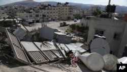 Remnants of the home of a Palestinian man accused of carrying out a deadly shooting attack earlier this year are seen after it was demolished by Israeli forces, at the Askar refugee camp in the West Bank city of Nablus, Aug. 8, 2023.