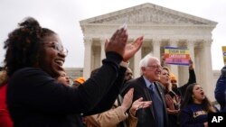 Sen. Bernie Sanders attends a rally for student debt relief advocates outside the Supreme Court on Capitol Hill in Washington, Feb. 28, 2023,