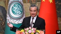 FILE - Chinese Foreign Minister Wang Yi speaks at a press conference in Beijing, May 30, 2024.