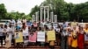 Relatives of the people who disappeared during the reign of Awami League, gather to demand justice at the Shaheed Minar, in Dhaka, Aug. 11, 2024. 