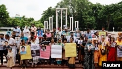 Relatives of the people who disappeared during the reign of Awami League, gather to demand justice at the Shaheed Minar, in Dhaka, Aug. 11, 2024. 