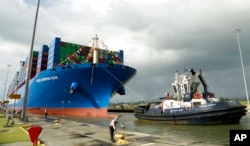 FILE - The Chinese container ship Cosco docks at the Cocoli Locks in Panama City, Dec. 3, 2018.