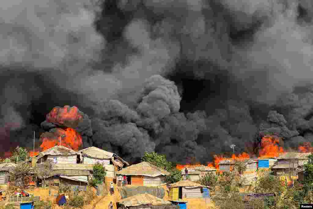 Fire burns in the Rohingya refugee camp in Balukhali in Cox&#39;s Bazar, Bangladesh.