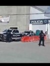 Police stand guard at their station in Ensenada, Mexico, May 2, 2024. Mexican authorities said that day that they had found tents and questioned people in the case of three tourists missing in Baja California. Three bodies were found in the area Friday.