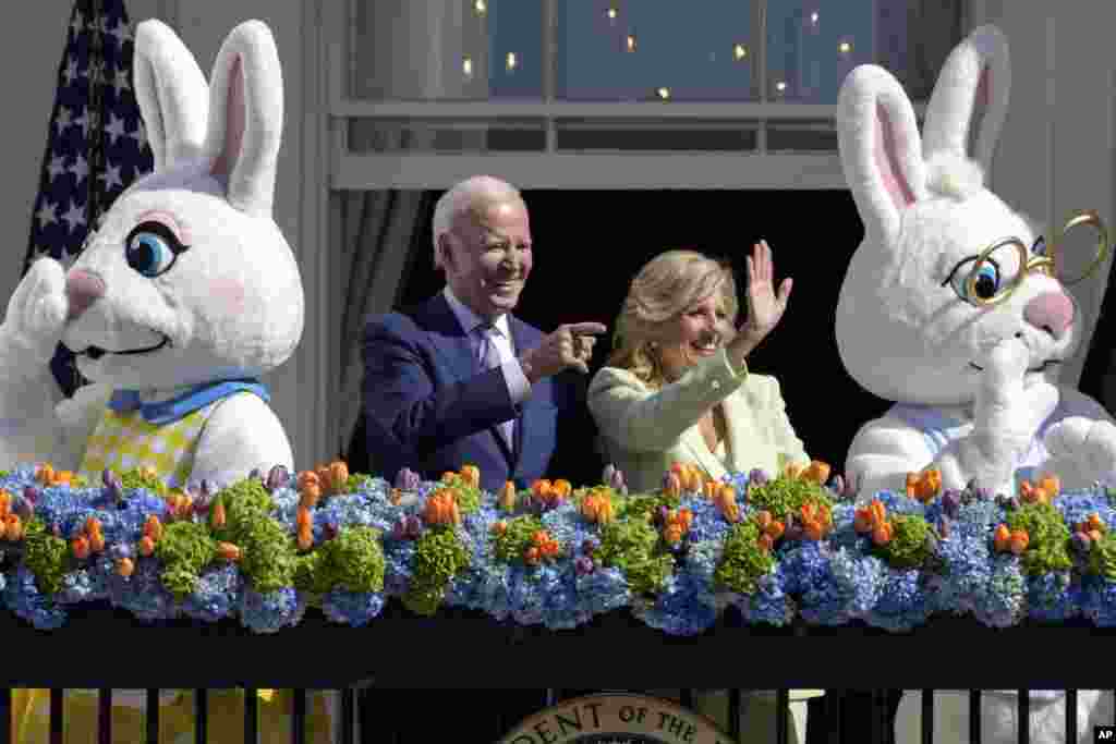 President Joe Biden stands with first lady Jill Biden on the Blue Room Balcony during the 2023 White House Easter Egg Roll in Washington.