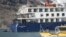 The "Ocean Explorer," a Bahamas-flagged Norwegian cruise ship with 206 passengers and crew, ran aground in northwestern Greenland on Sept. 11, 2023. (SIRIUS/Joint Arctic Command via AP)