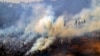 After destroying nearly 200 structures, US wildfire threatens thousands more