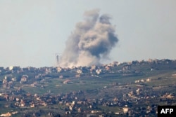 FILE - This picture taken from Israel along the border with southern Lebanon shows smoke billowing above the Lebanese village of Bint Jbeil during Israeli bombardment, Feb. 28, 2024.