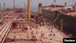 A view of a pipe laid between the decaying supertanker FSO Safer and its replacement tanker, the Nautica, off the coast of Ras Issa, Yemen, in pictured in this screengrab from a recent undated handout video.