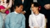 FILE - Win Myint, left, since ousted as Myanmar's president, speaks to Aung San Suu Kyi after the fourth anniversary of Nationwide Cease-fire Agreement at the Myanmar International Convention Center in Naypyitaw, Myanmar, Oct. 28, 2019.