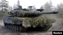 FILE - A Leopard battle tank takes part in a training exercise at the Niinisalo garrison in Kankaanpaa, Finland, May 4, 2022.