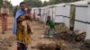 FILE - A woman and child among those displaced by fighting are pictured at a refugee camp on the outskirts of Goma, Democratic Republic of the Congo, July 11, 2024.