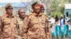 FILE - Sudan's army chief Abdel Fattah al-Burhan visits casualties receiving treatment at a hospital in the southeastern Gedaref state, April 10, 2024. De facto leader received an Iranian ambassador, July 21, 2024 and sent his own to Tehran, the government said.