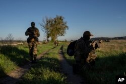 Ukrainian Border Guard soldiers participate in a military exercise in central Ukraine, May 2, 2023.