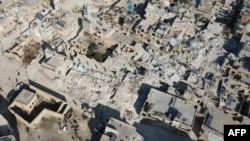 An aerial view shows collapsed buildings following last week's earthquake in Syria's rebel-held village of Atarib, in the northwestern Aleppo province, Feb. 14, 2023. 