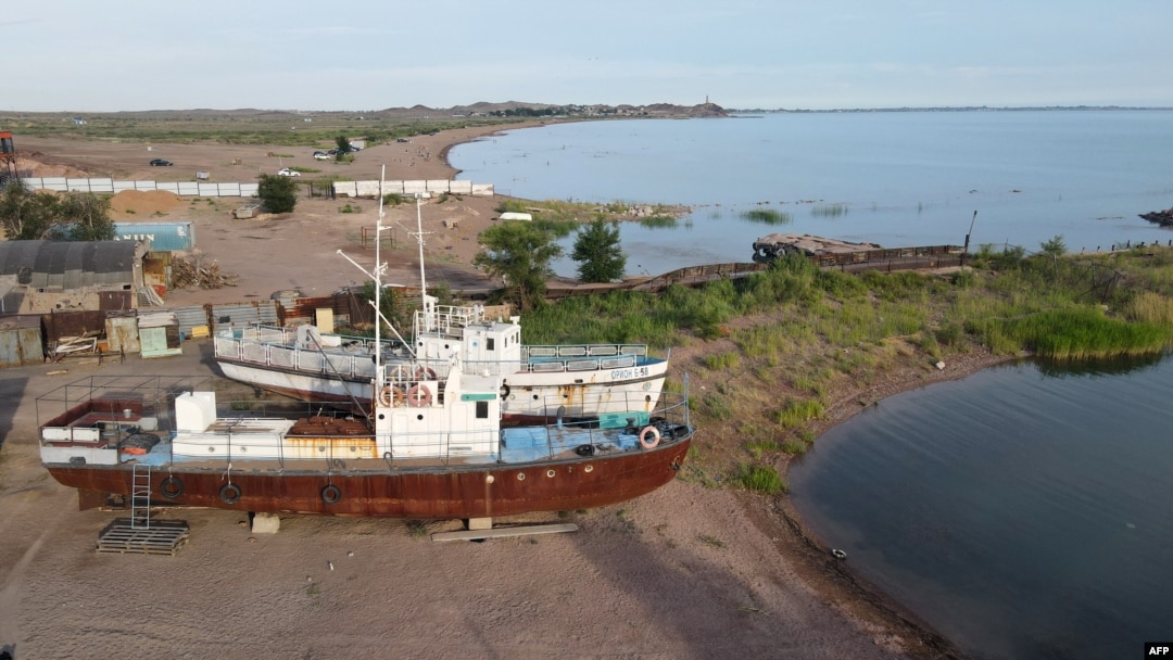 Rusted vessels rest on the shore of Lake Balkhash in Kazakhstan on June 18, 2024.