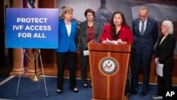 Sen. Tammy Duckworth, of Illinois speaks about a bill to establish federal protections for IVF as, from left, Sen. Tammy Baldwin, Sen. Amy Klobuchar, Senate Majority Leader Chuck Schumer and Sen. Patty Murray listen Feb. 27, 2024, in Washington. 