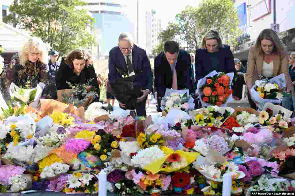 Australian Prime Minister Anthony Albanese and New South Wales Premier Chris Minns join other politicians as they lay flowers at the scene of Saturday&#39;s mass stabbing at Bondi Junction, Sydney.