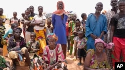 FILE - Internally displaced people wait for aid in Djibo, Burkina Faso, May 26, 2022. The OIC said it will assist Burkina Faso, Niger, Mali, Pakistan, Syria, Afghanistan, Somalia and Nigeria — the member countries with the highest death tolls from terrorism.