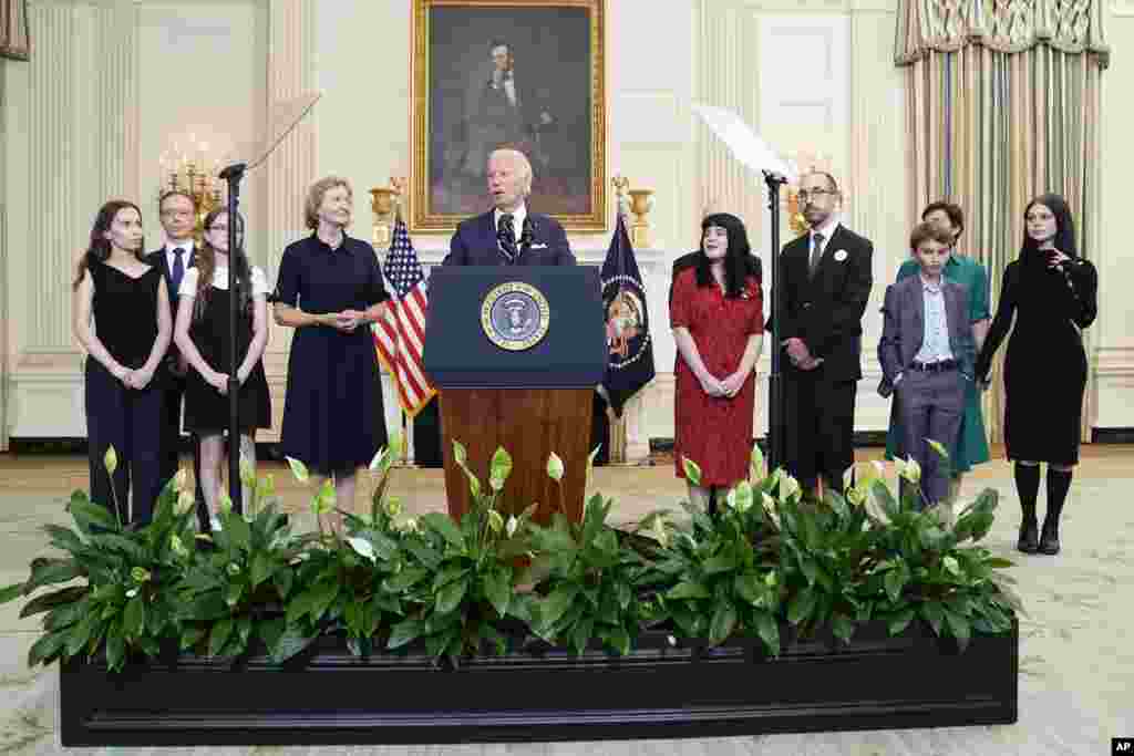 President Joe Biden, center, delivers remarks on a prisoner swap with Russia from the State Dining Room of the White House in Washington.