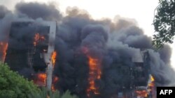 Incêndio violento na torre da Greater Nile Petroleum Oil Company em Cartum, capital do Sudão. 17 de setembro.