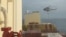 FILE - In this photo taken from video, an Iranian commando rappels from a helicopter in a raid on the MSC Aries in the Strait of Hormuz on April 13, 2024.
